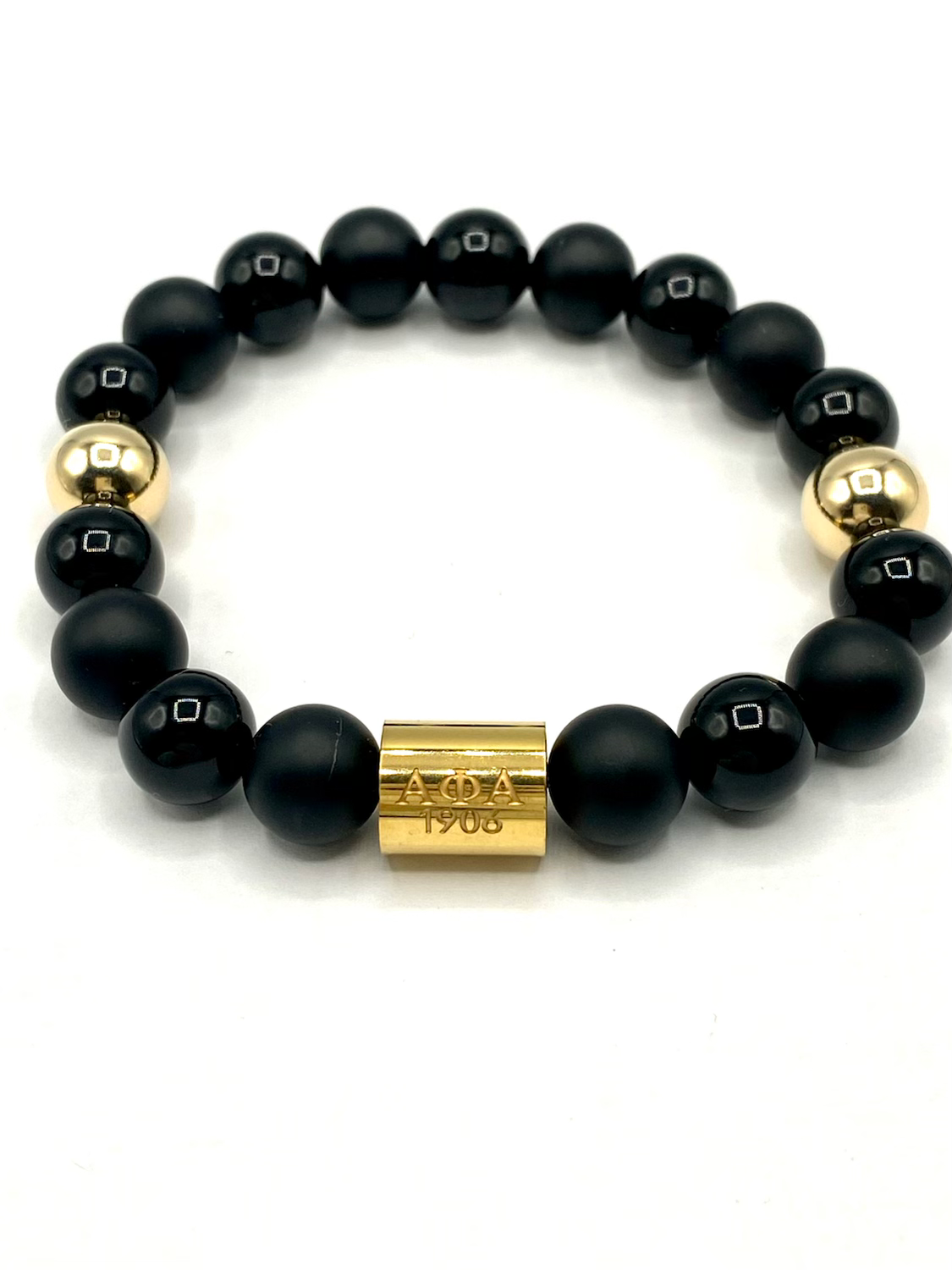 Alpha Kappa Alpha beaded bracelet with gold accent beads and matte and polished black onyx beads